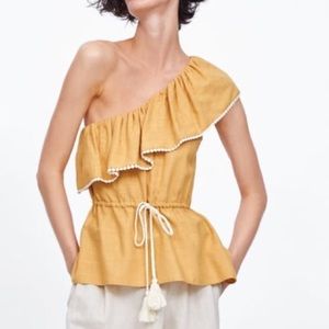 Asymmetric ruffles top in mustard. Size S